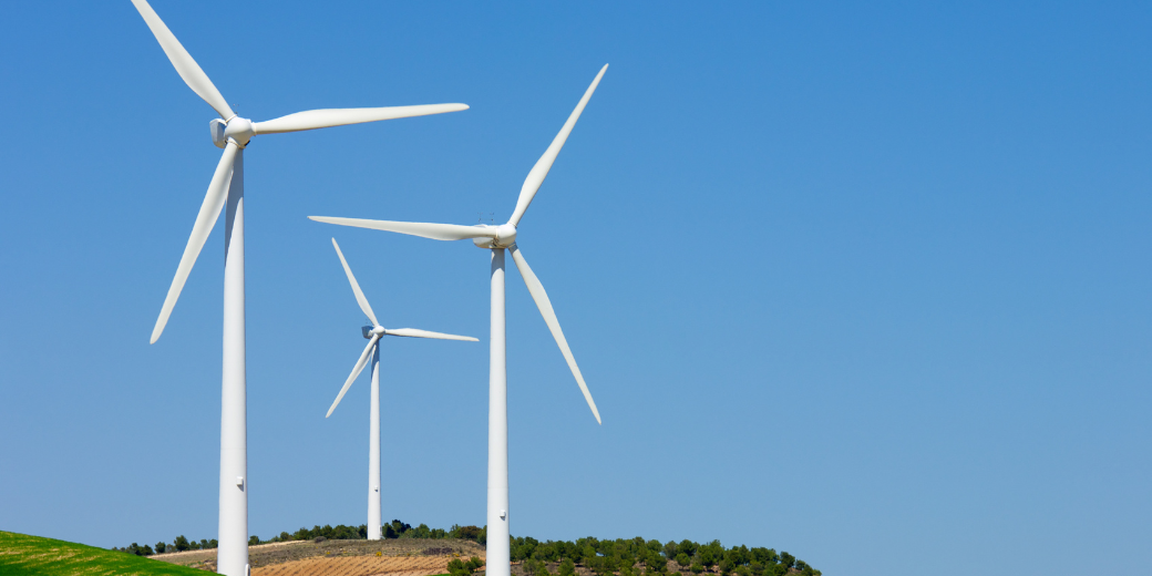 image of windmills for renewable electric energy production as a cleaner solution